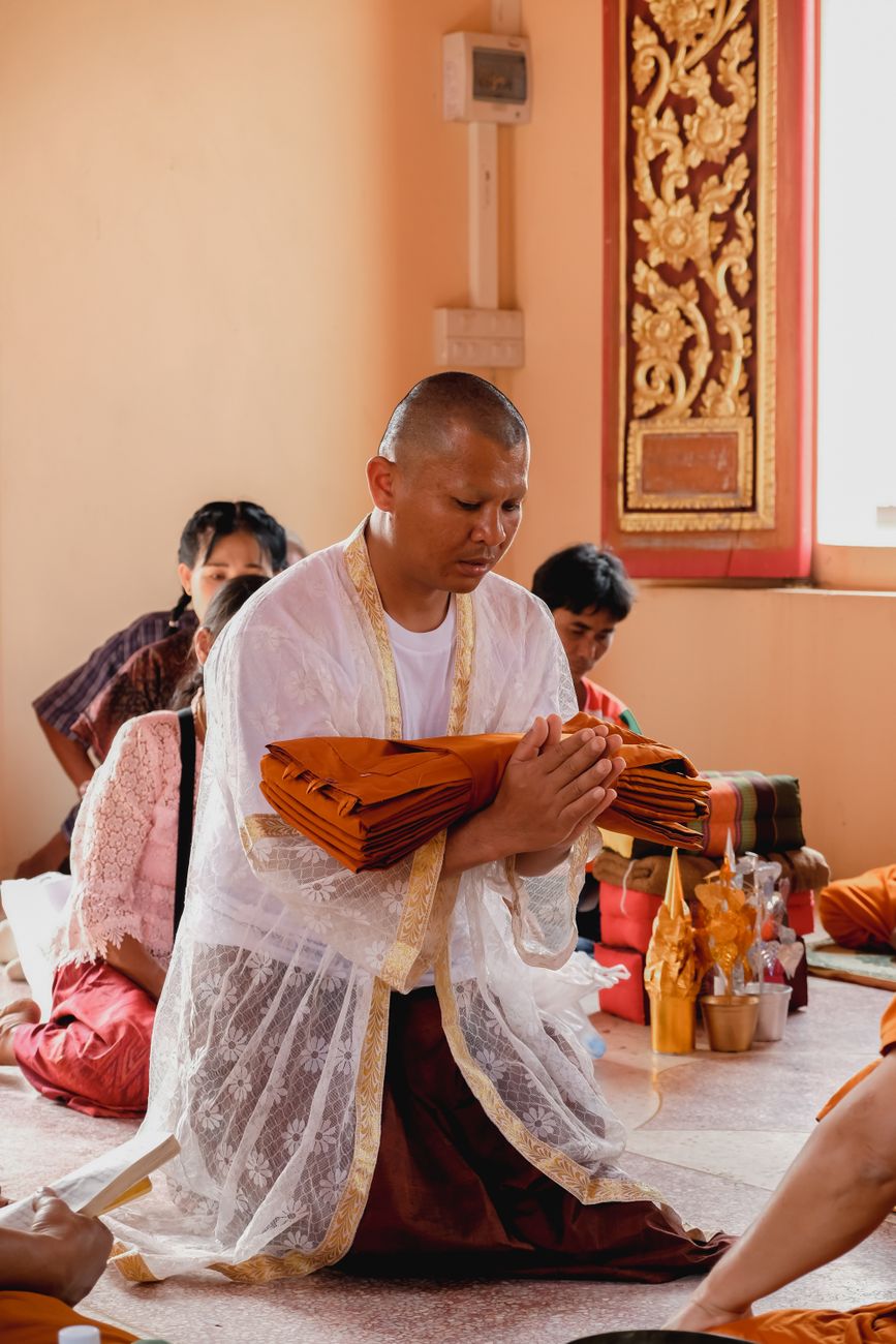 people praying in a temple